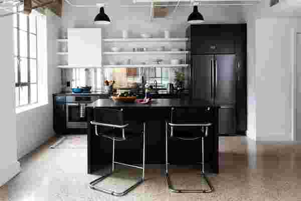 A Mirrored Backsplash and Terrazzo Flooring Lighten Up This Historic Kitchen